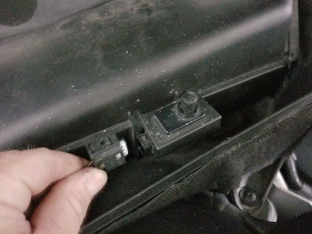 Disconnect the hood sensor switch on right cabin filter container