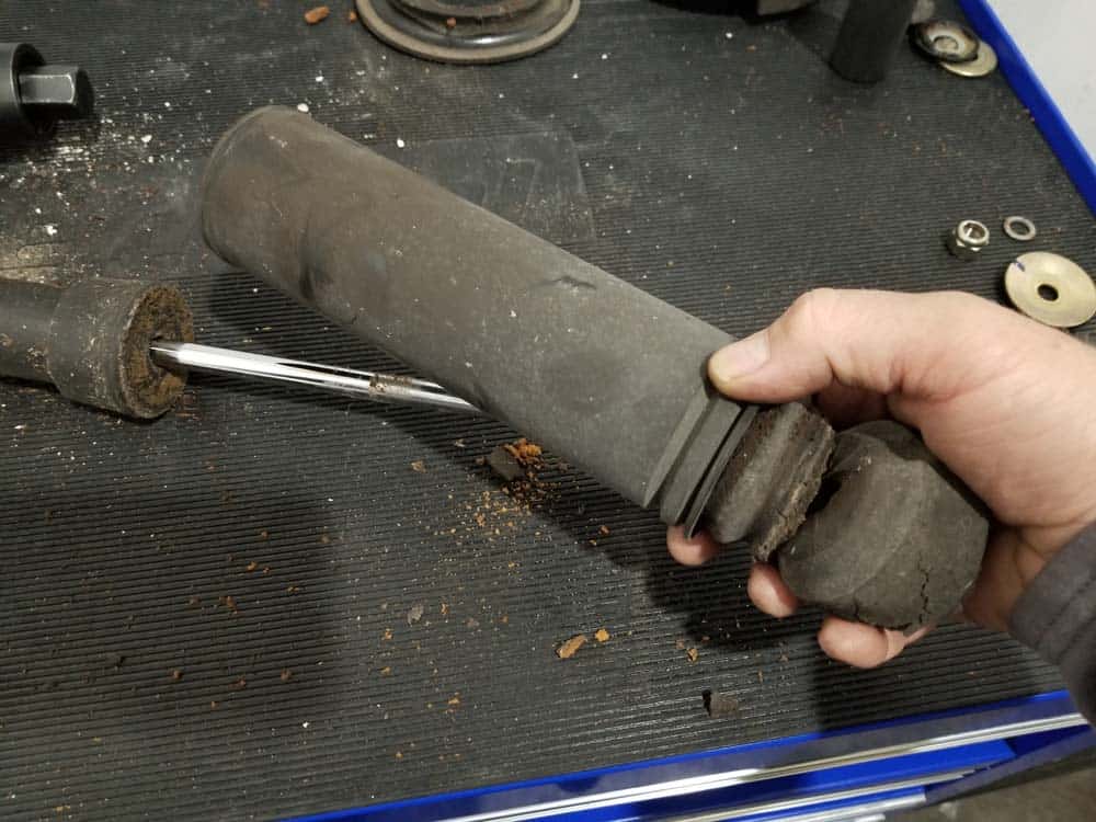 remove old bump stop and dust cover