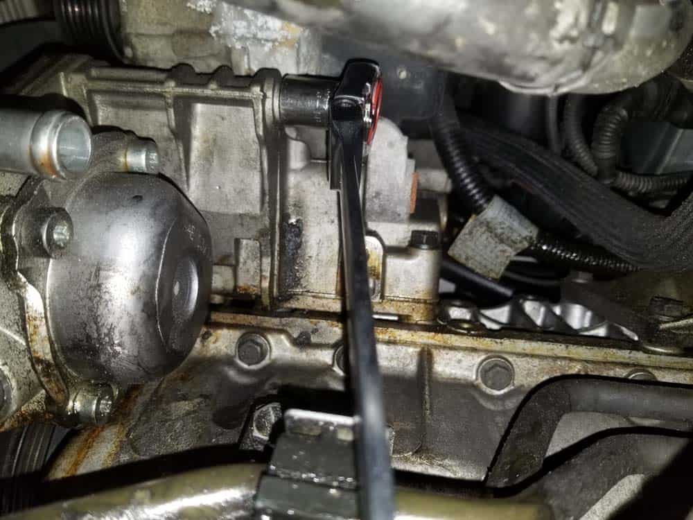 remove rear mounting bolt