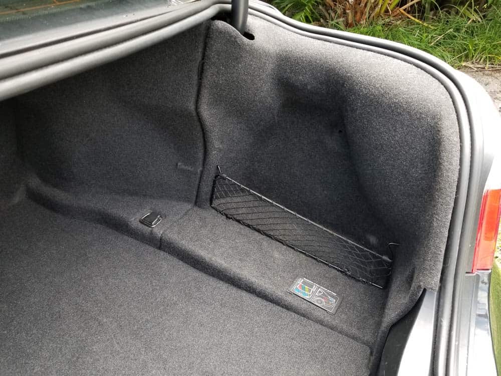 bmw e60 battery sensor - accessing battery compartment in sedan models