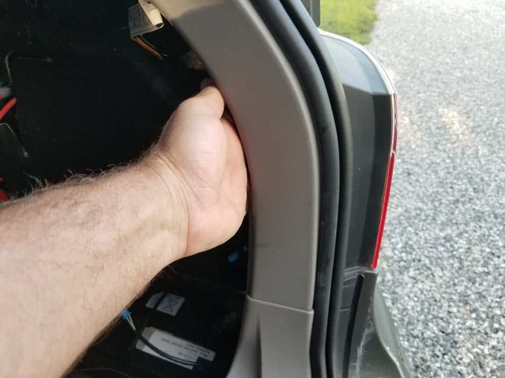 bmw e61 trunk leak - unsnap the bottom portion of the trim