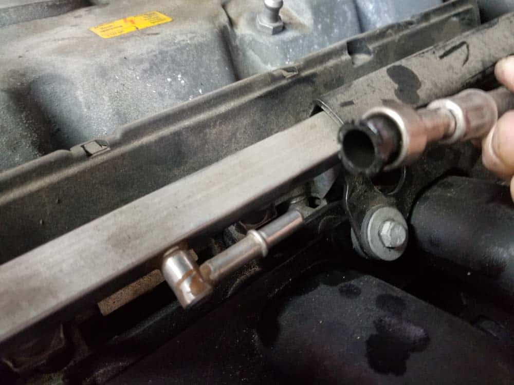 Pull fuel line free from fuel rail