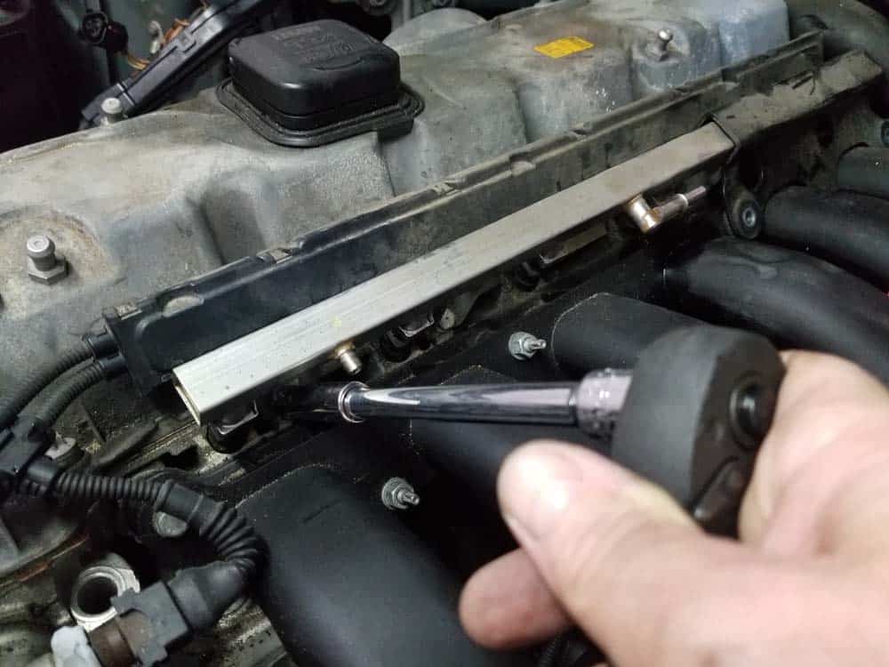 BMW E60 valve cover repair - remove fuel rail mounting bolts