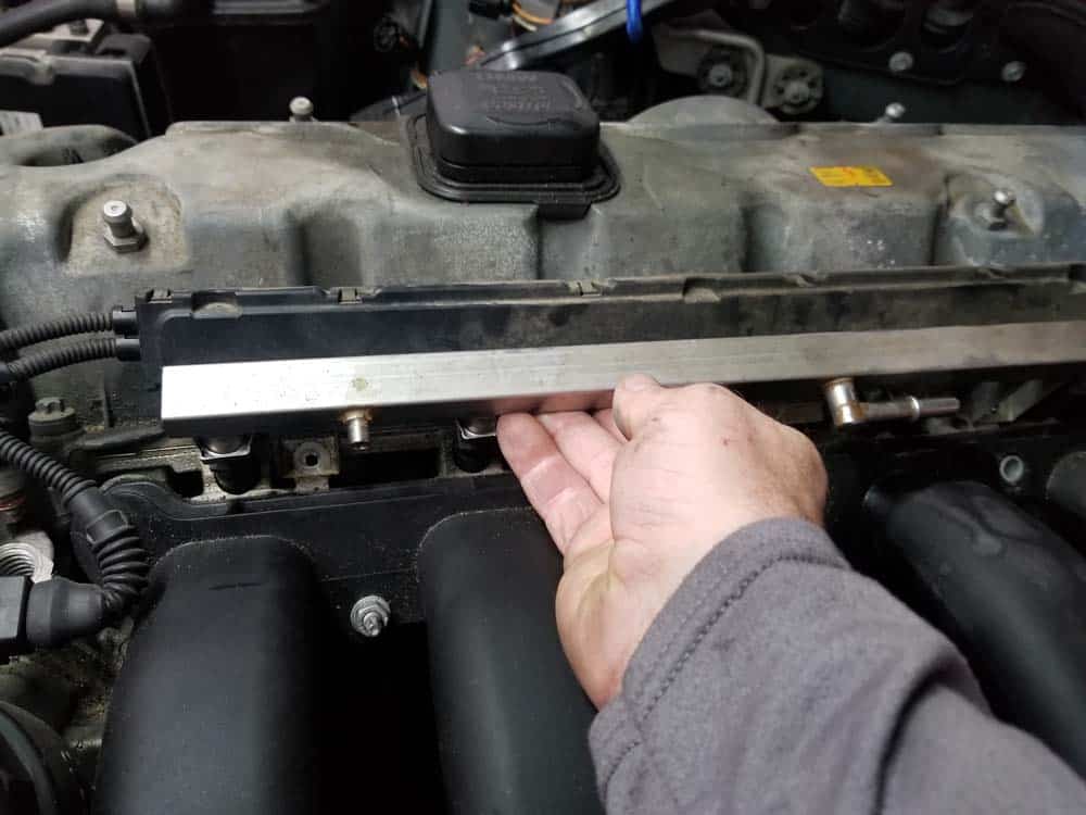 BMW E60 valve cover repair - remove fuel rail from car