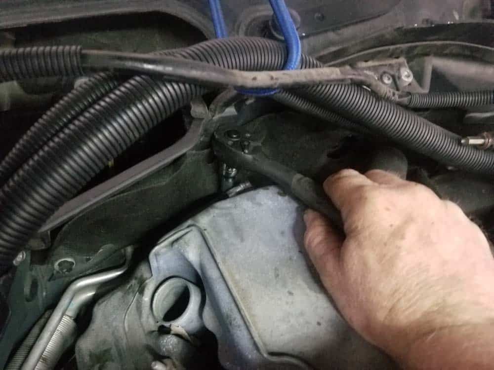 BMW E60 valve cover repair - rear mounting bolts are hidden.