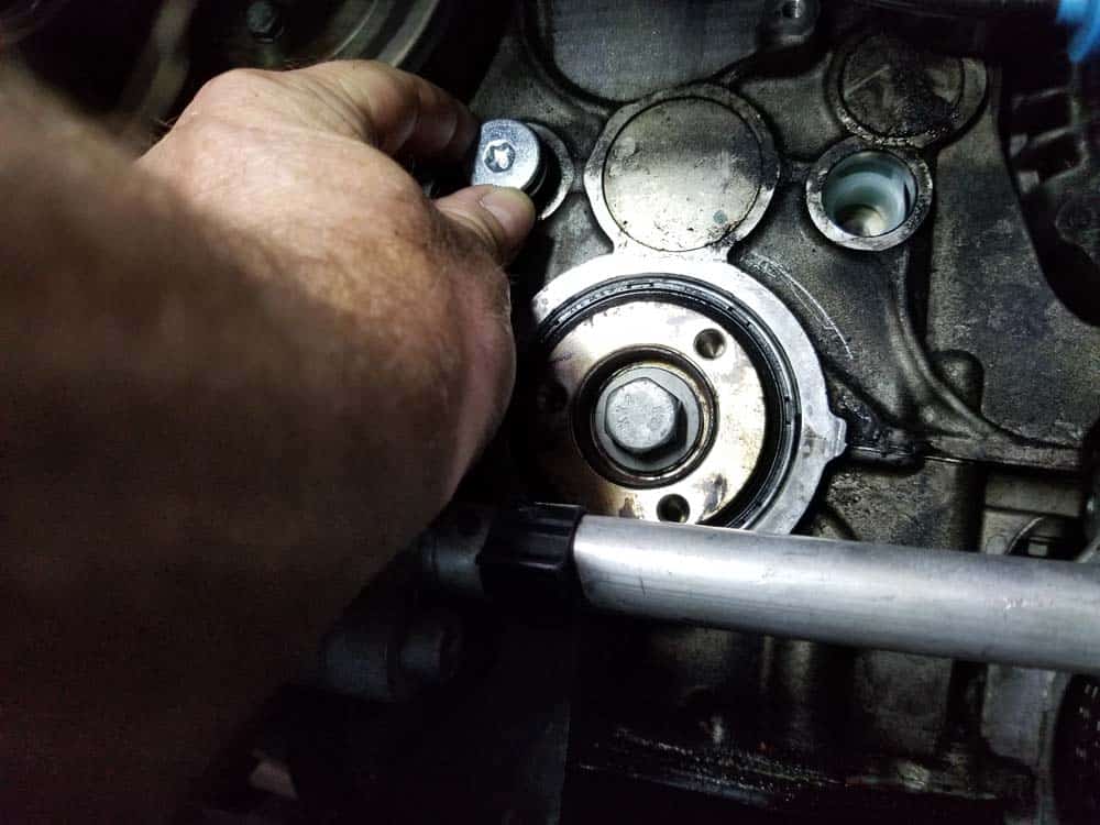 Install the three bearing bolts back into the engine