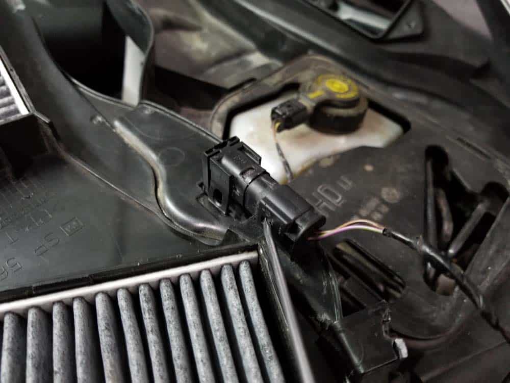 Use a flat blade screwdriver to disconnect hood switch