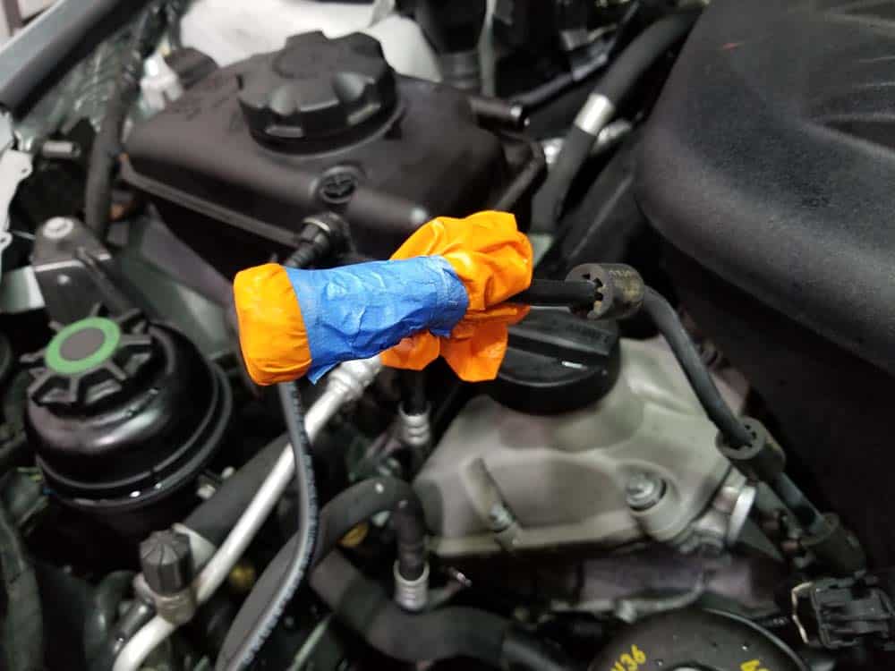 BMW E90 M3 tune up - tape end of overflow tube to keep it from leaking coolant
