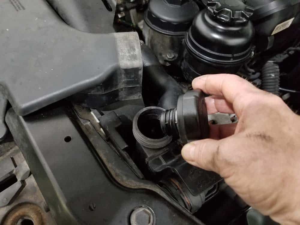 Remove the expansion tank cap
