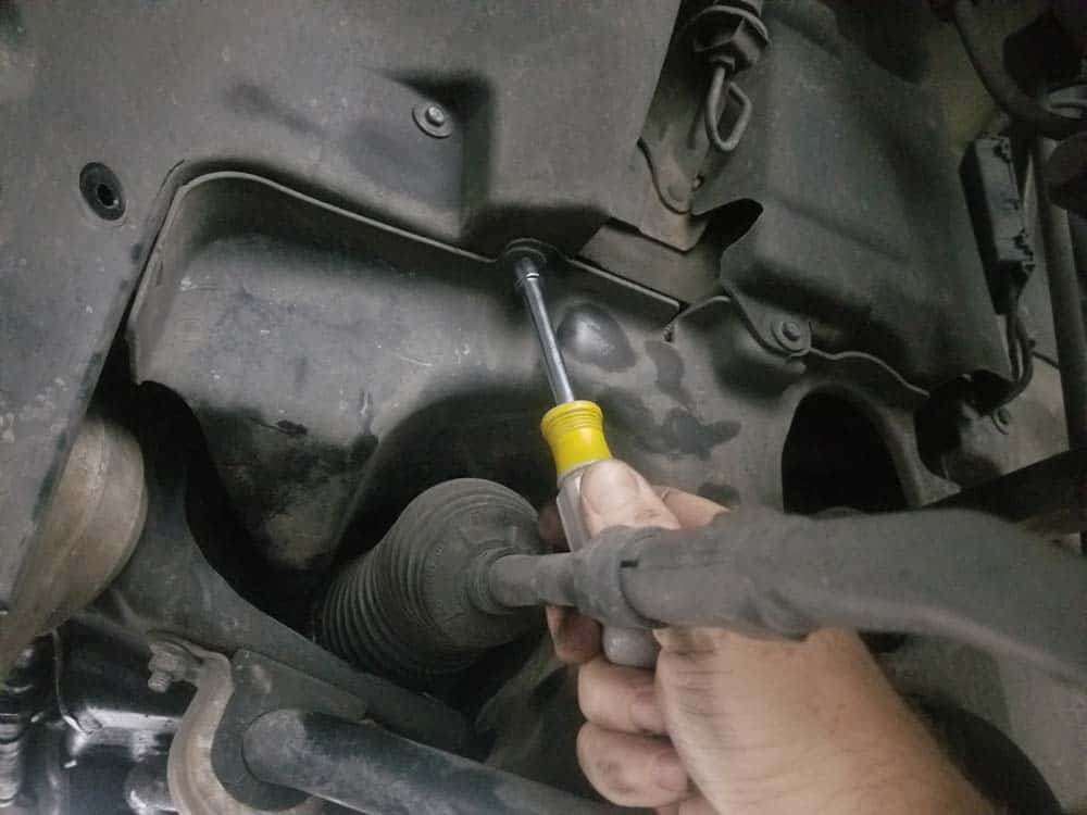 BMW E60 xDrive front control arms - remove a couple of the side suspension cover screws