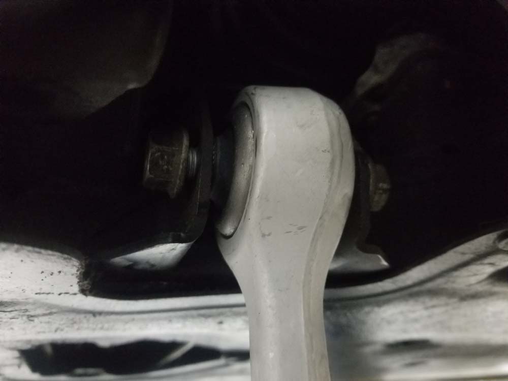 BMW E60 xDrive front control arms - install the lower control arm bushing mounting bolt.