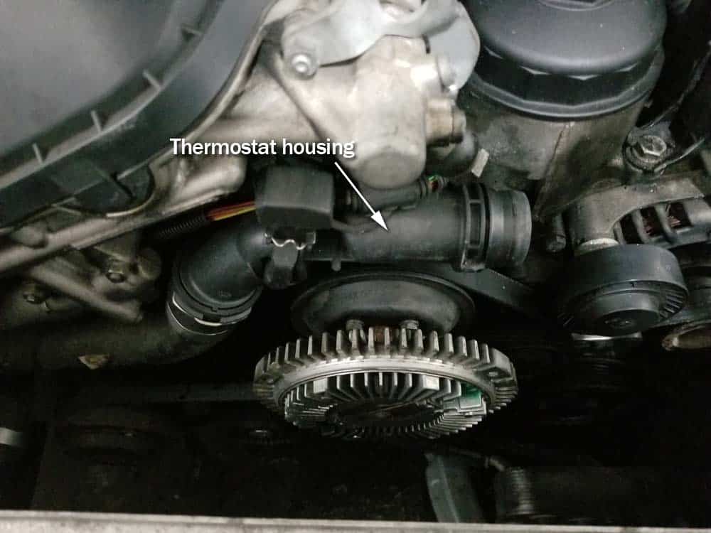 bmw e46 thermostat - locate the thermostat housing on the front of the engine