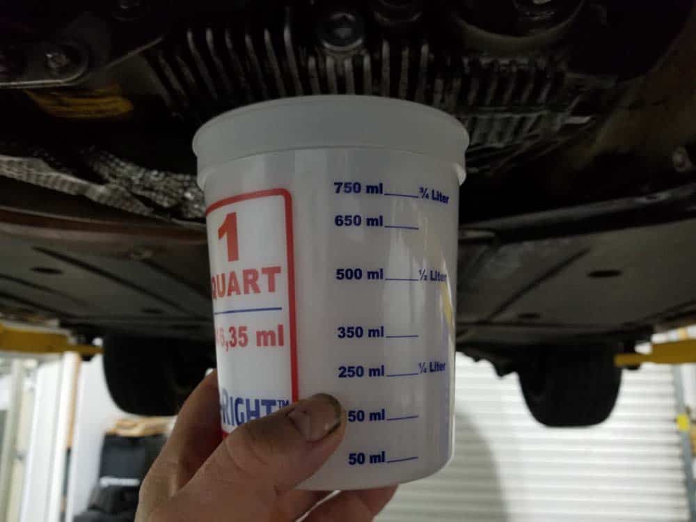 Drain the old transfer case fluid into a plastic cup so you can practice refilling in section 2 below.