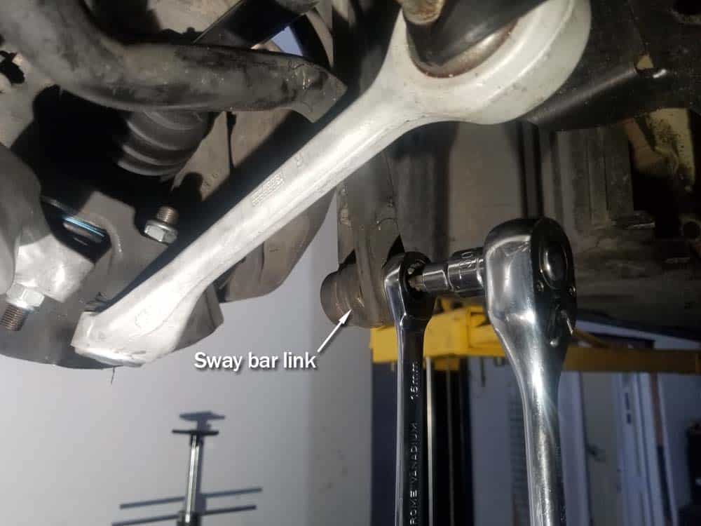 bmw e60 front axle shaft - Remove the sway bar link.