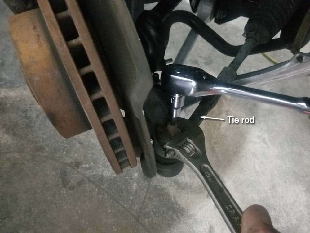 bmw e60 front axle shaft - remove the tie rod ball joint nut.
