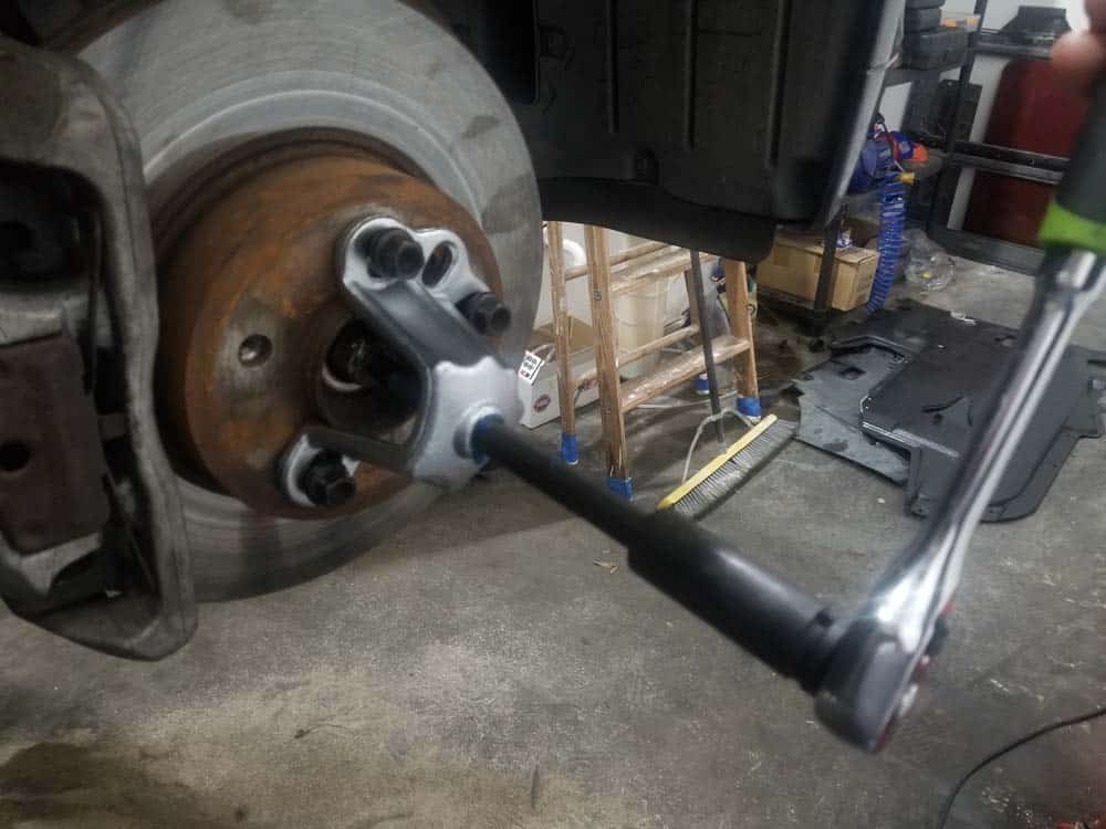 bmw e60 front axle shaft - Tighten the hub puller and slowly push the drive axle out of the hub.