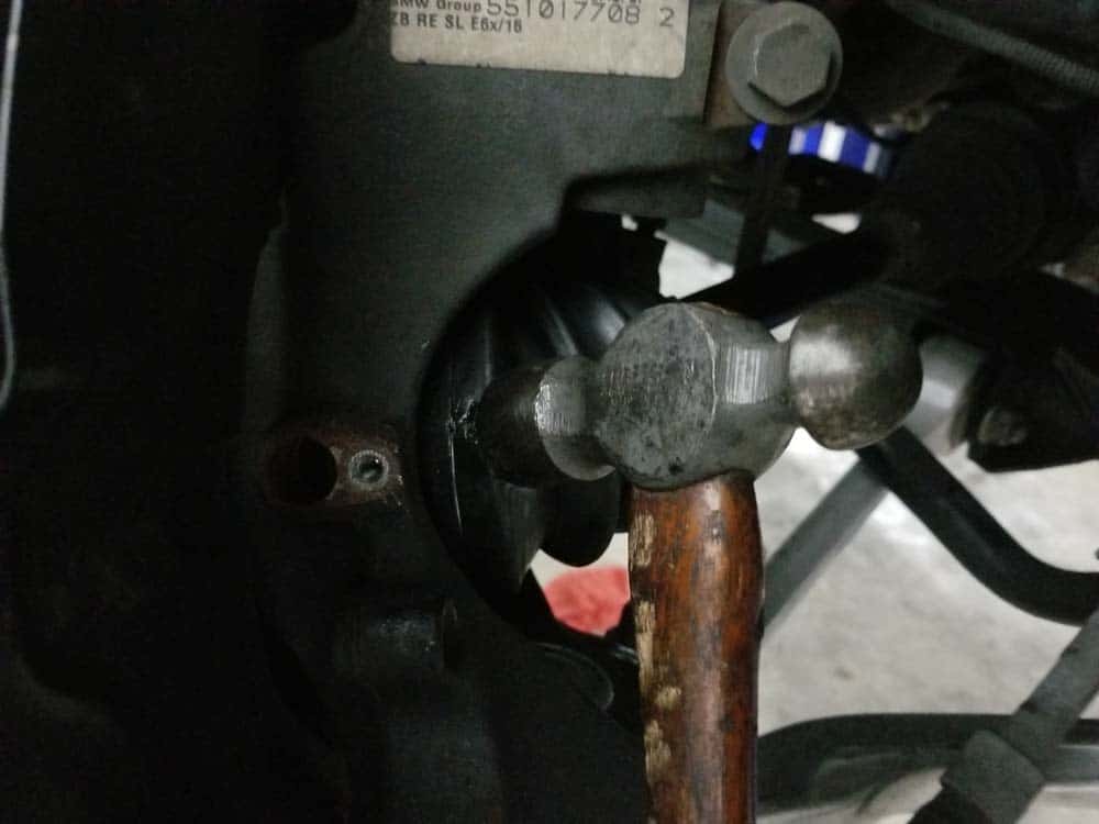 bmw e60 front axle shaft - Strike the axle right behind the steering knuckle to get it to release.