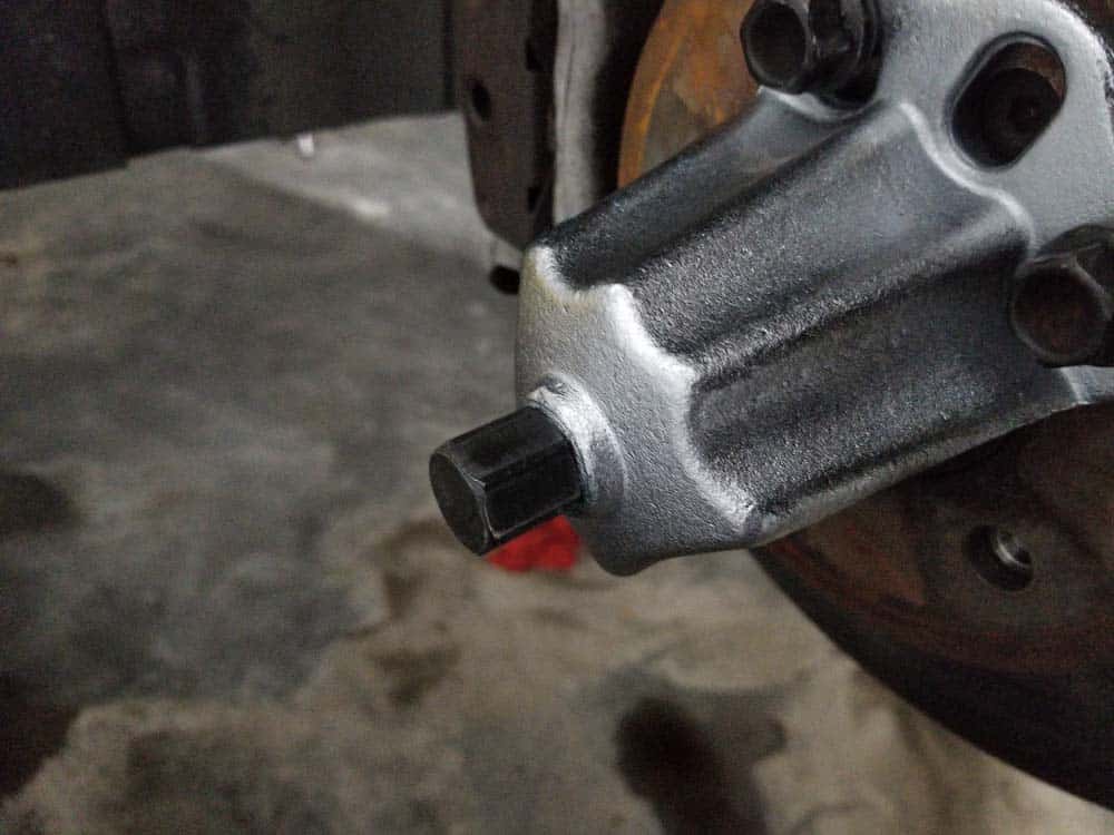 bmw e60 front axle shaft - Tighten the threaded rod all the way until it pushes the axle out of the back of the steering knuckle.