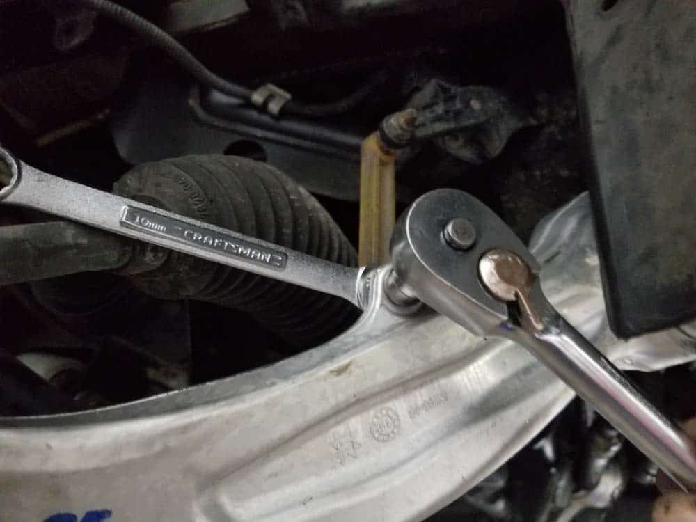 bmw e60 front axle shaft - If working on the right wheel, remove the headlight vertical aim control sensor.