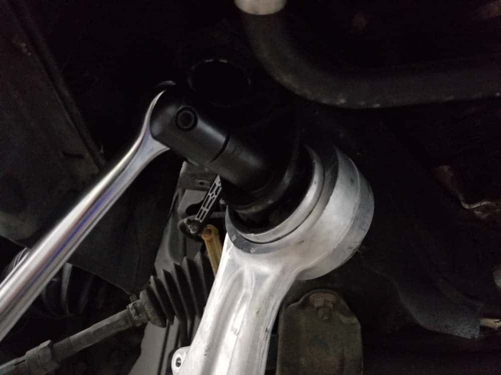 bmw e60 front axle shaft - Loosen the upper control arm bushing bolt