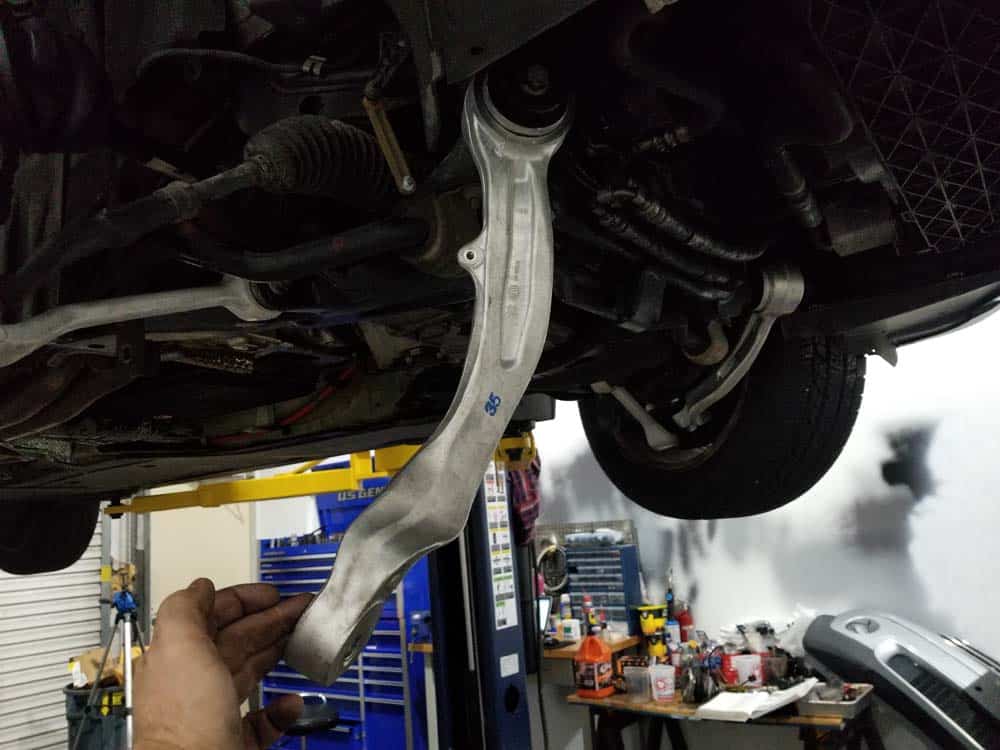 bmw e60 front axle shaft - Swing the upper control arm down and out of the way.