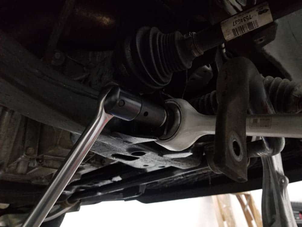 bmw e60 front axle shaft - Loosen the lower control arm bushing bolt.