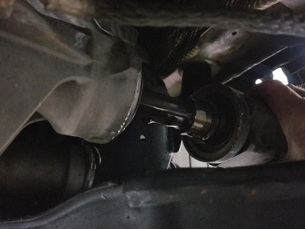 bmw e60 front axle shaft - Pull the drive axle out of the differential.