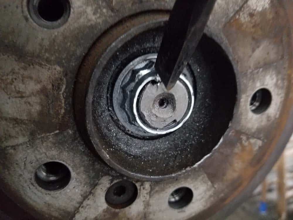 bmw e60 front axle shaft - Strike the axle nut at the shaft cut outs to create locking tabs.