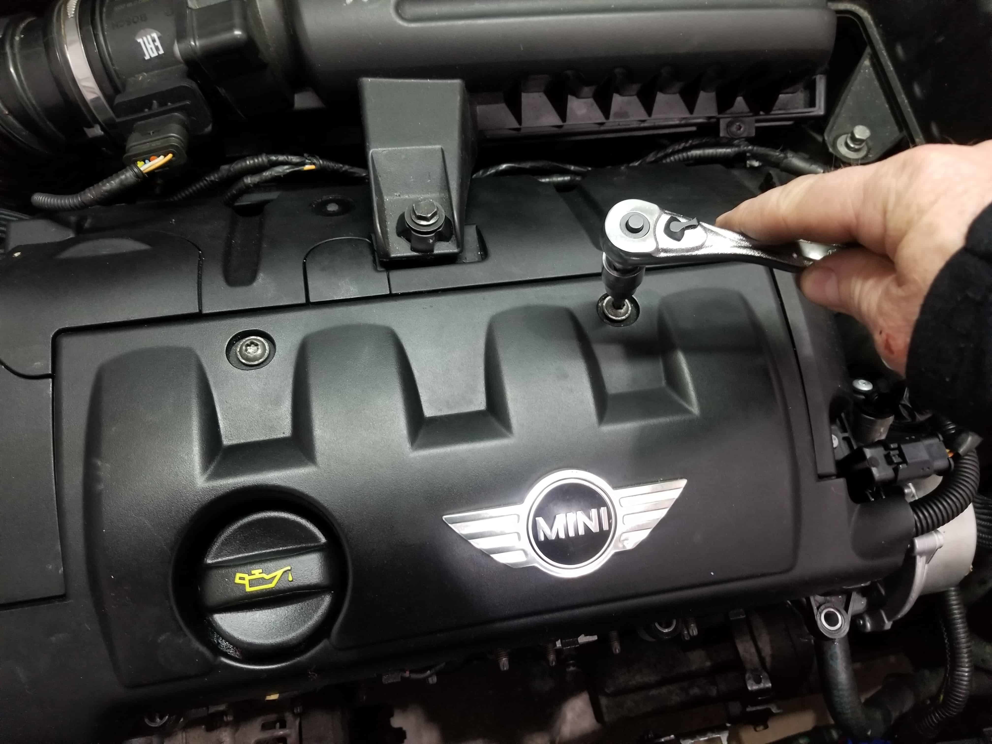 MINI R56 Tune Up - Remove the two engine cover mounting bolts.