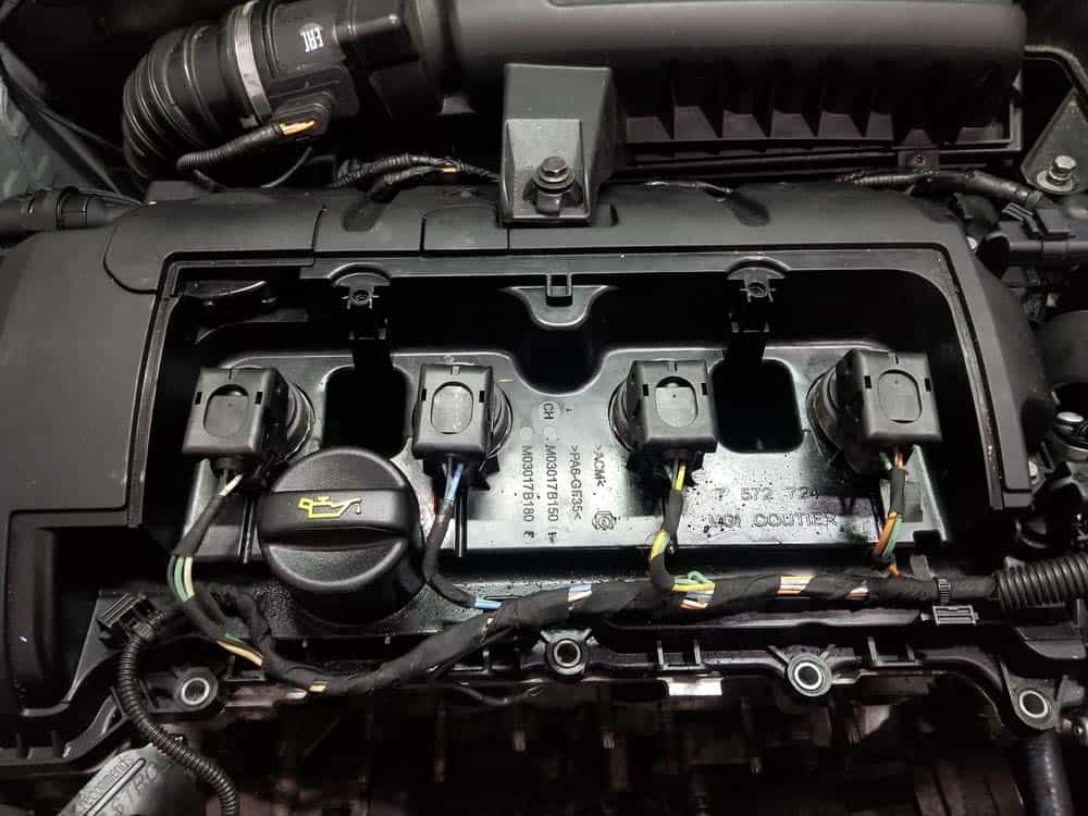 Locate the four ignition coils inside engine compartment.