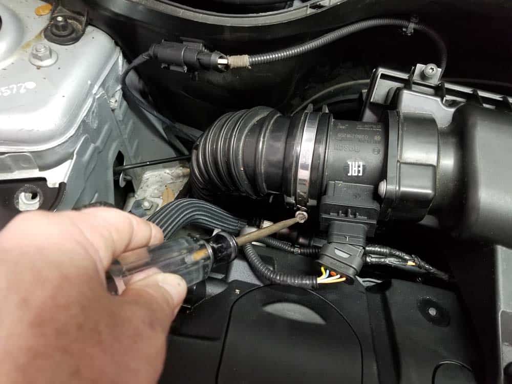 MINI R56 water pipe replacement - Loosen the hose clamp connecting the rubber boot to the intake muffler.