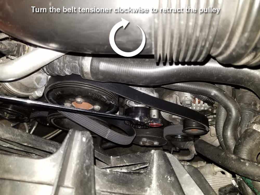 bmw E63 belt replacement - Turn the accessory belt tensioner clockwise to retract the pulley.