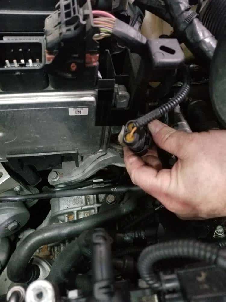 Disconnect the lower lead on the wiring harness