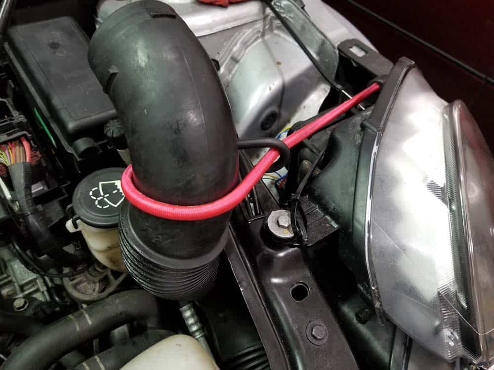 Bungee cord the intake tube out of the way instead of trying to disconnect it from the bumper