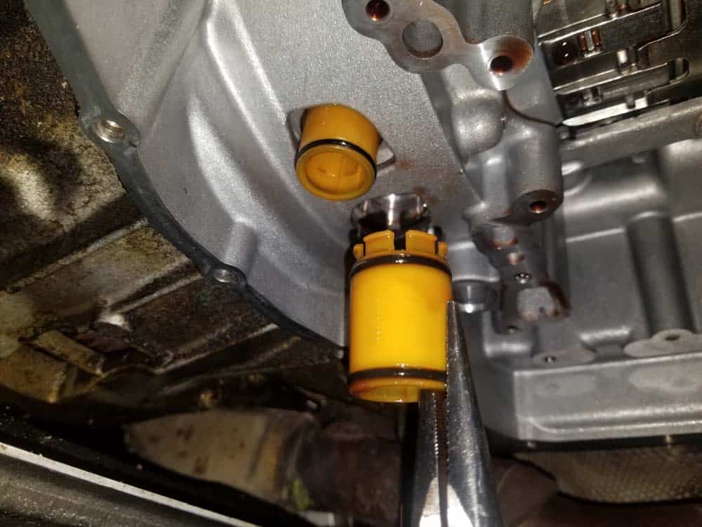 Remove the right pipe from the transmission.
