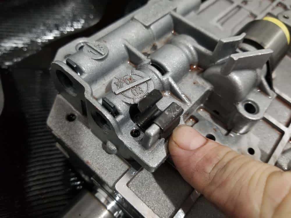 BMW 5HP19 solenoid replacement - Install the wiring harness clip into the valve body as shown.