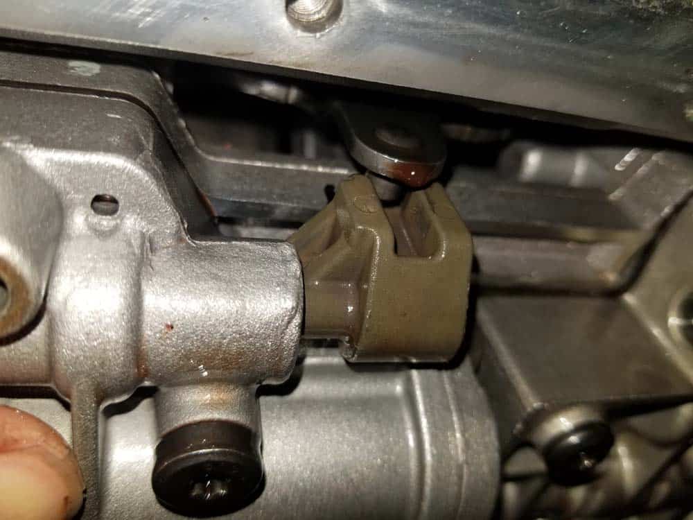 Make sure shift bracket pin lines up with piston rod in valve body.