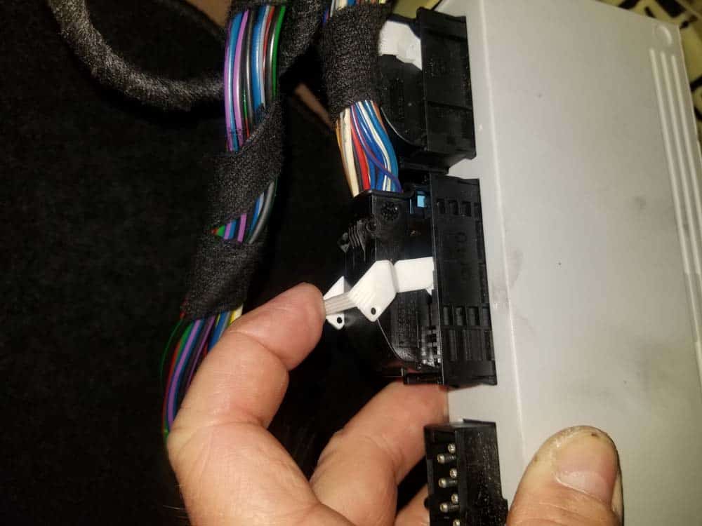 Disconnect the second wiring harness plug