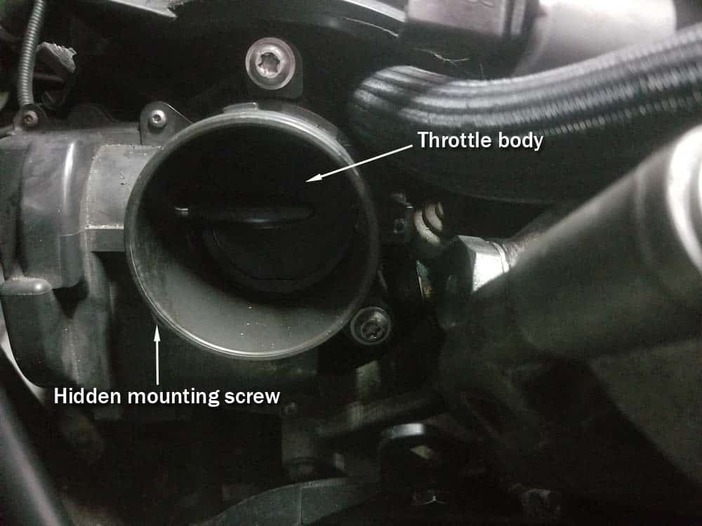 MINI R56 water pipe replacement - Throttle body and its mounting screw locations.