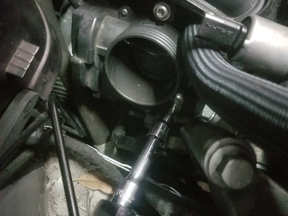 MINI R56 intake gasket repair - Remove the three throttle body screws.