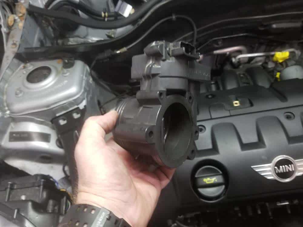 Remove the throttle body from the vehicle.