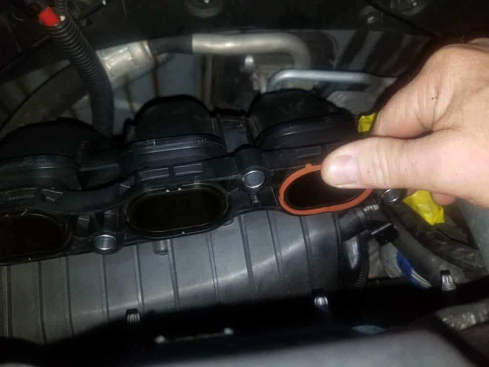 MINI R56 intake gasket repair - Install fresh intake manifold gaskets and press them in firmly with your thumb until properly seated.