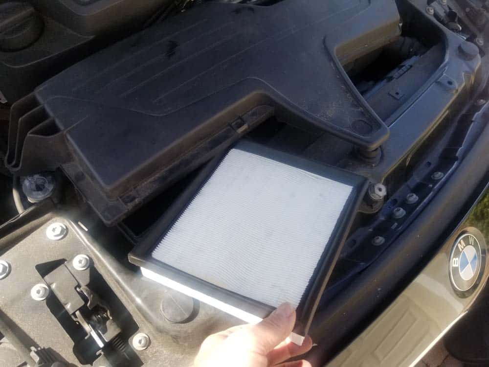 Remove the air filter from the engine