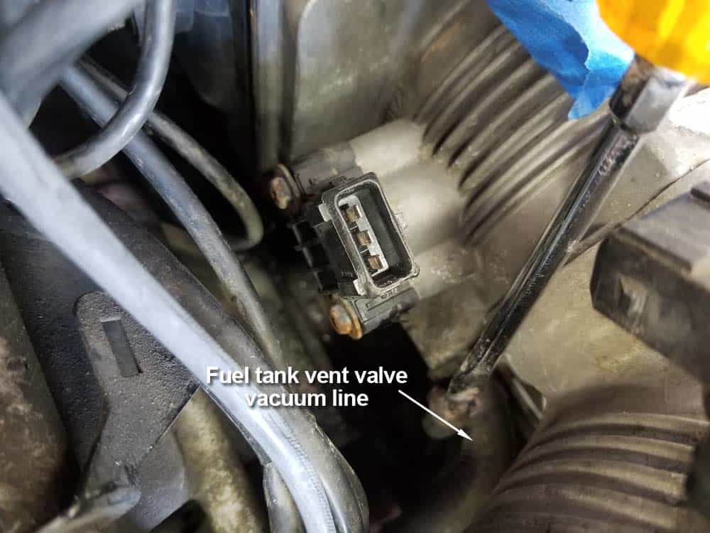 bmw M60 throttle body gasket replacement - Remove the fuel tank vent valve vacuum line from the throttle body.