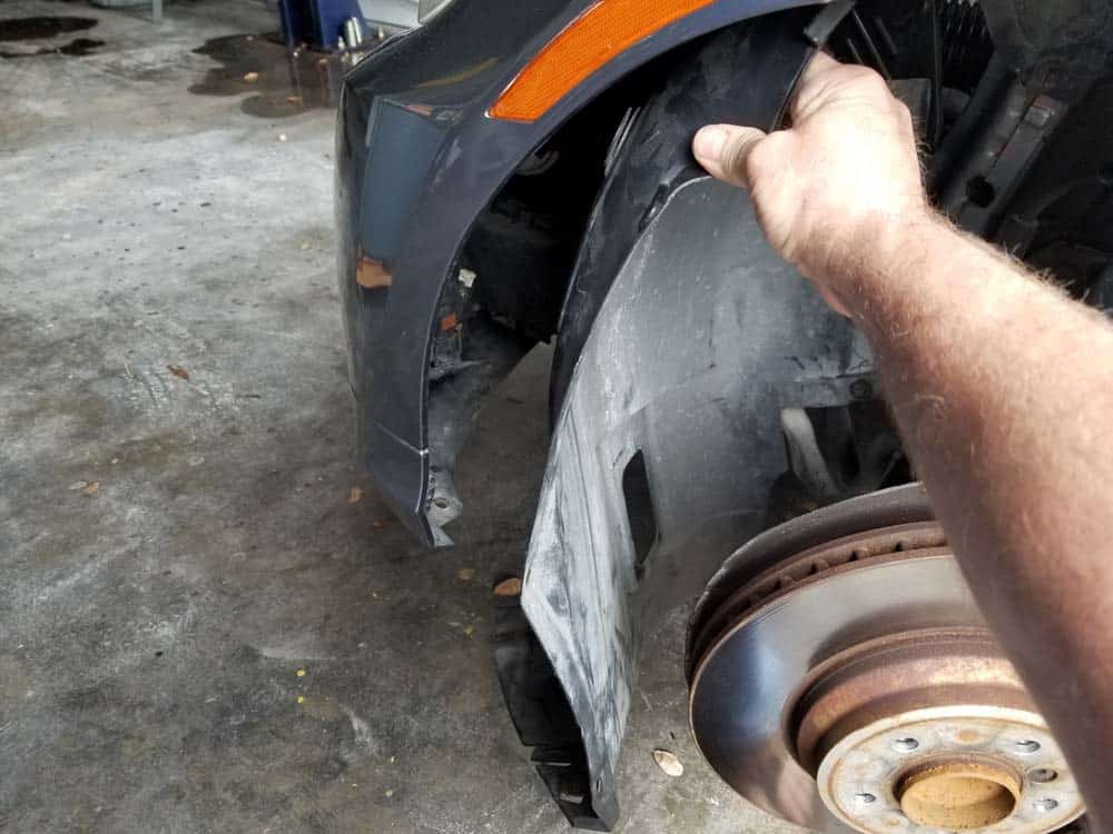 Remove the fender liner from the vehicle