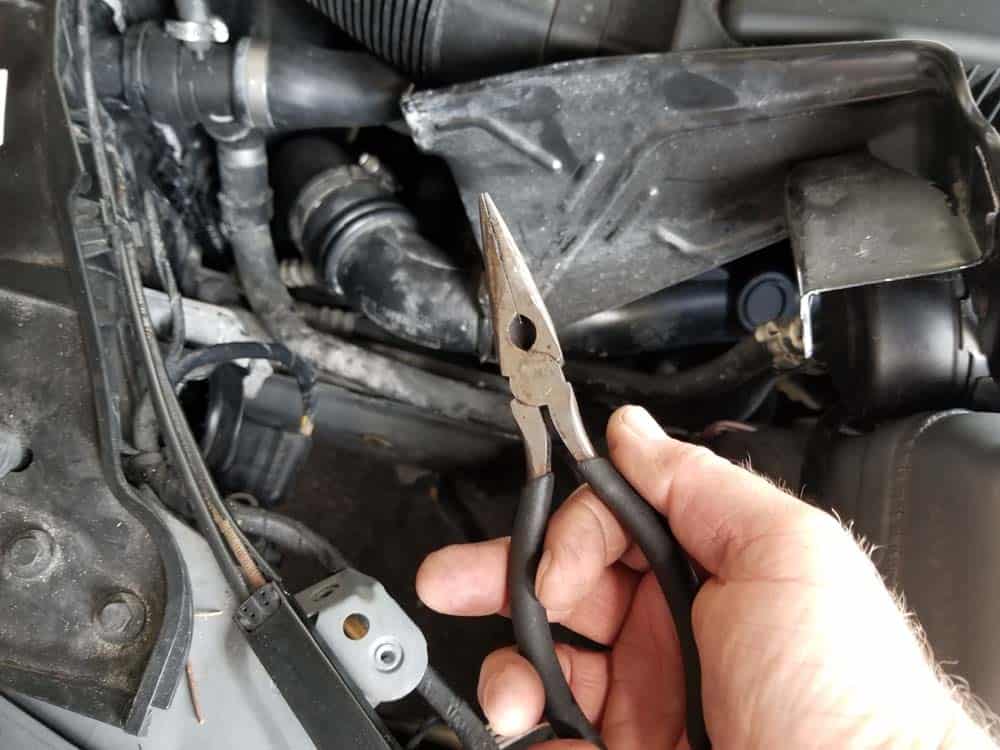bmw e90 angel eye bulb replacement - Use a pair of long nose pliers to remove the bulb