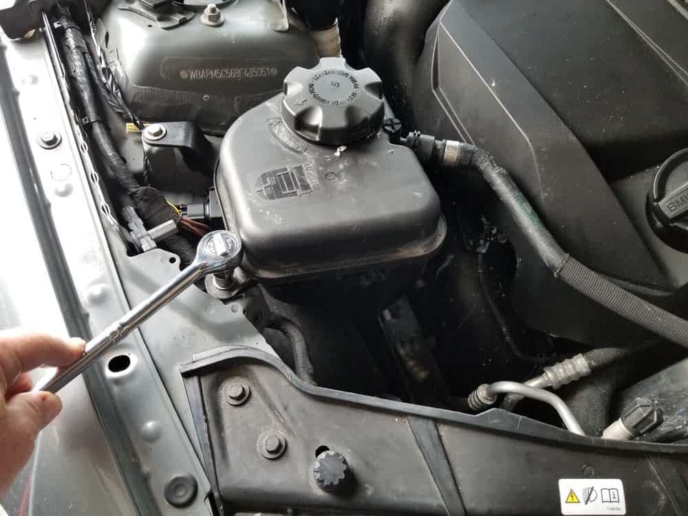 bmw e90 angel eye bulb replacement - Remove the two bolts anchoring the coolant expansion tank