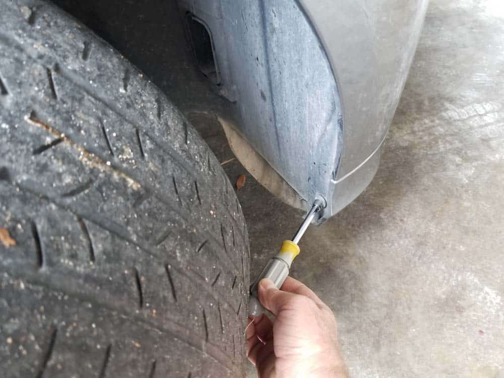 Remove first 8mm screw at bottom of the fender liner