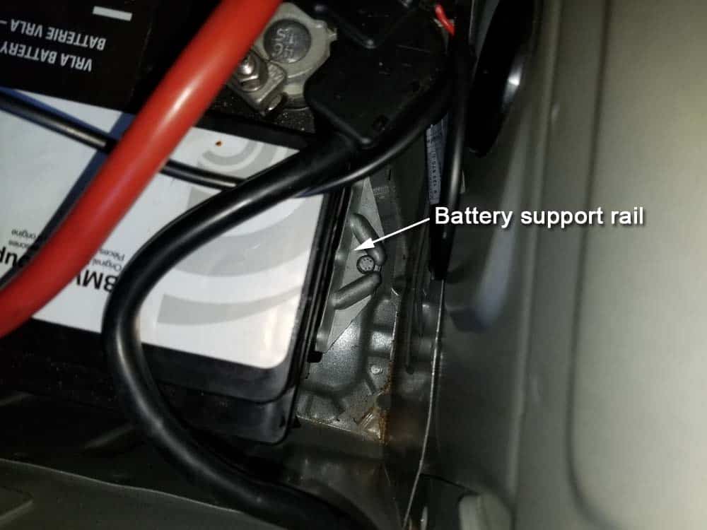 bmw e90 battery replacement - Locate the battery support rail