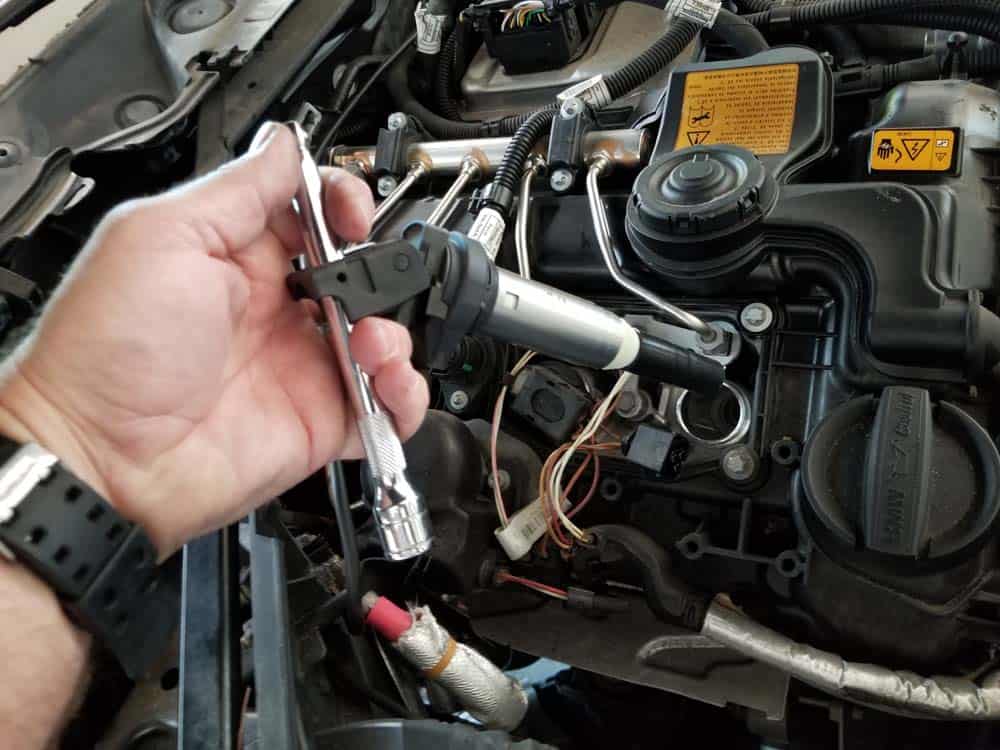 bmw f30 spark plug replacement - Pull the ignition coil out of the spark plug tube